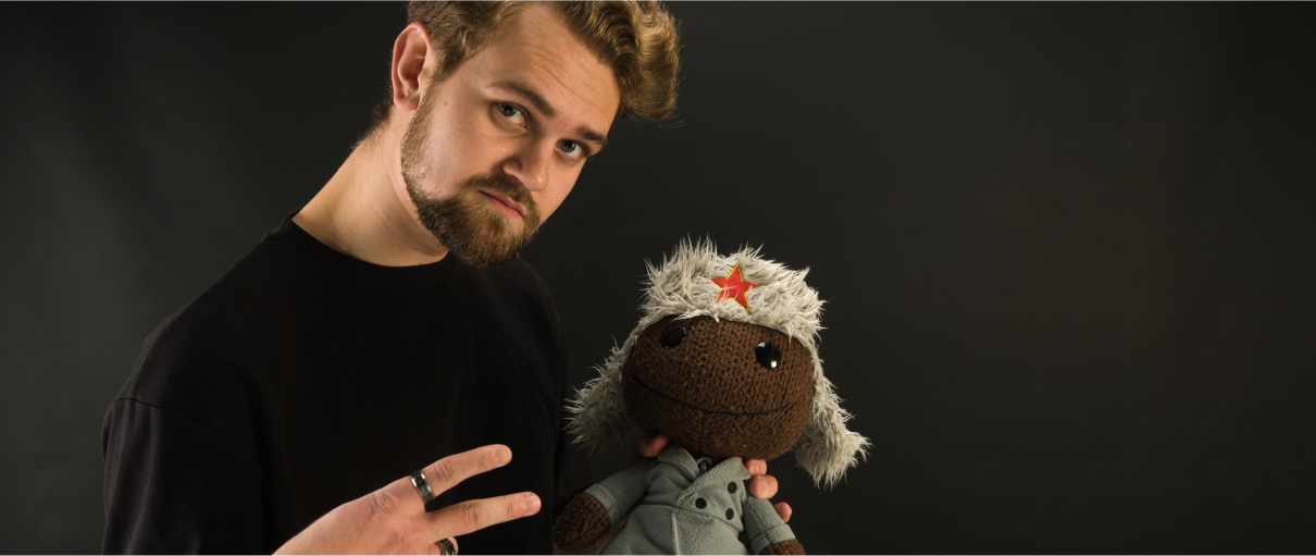 John hanging out with a Sackboy plushie