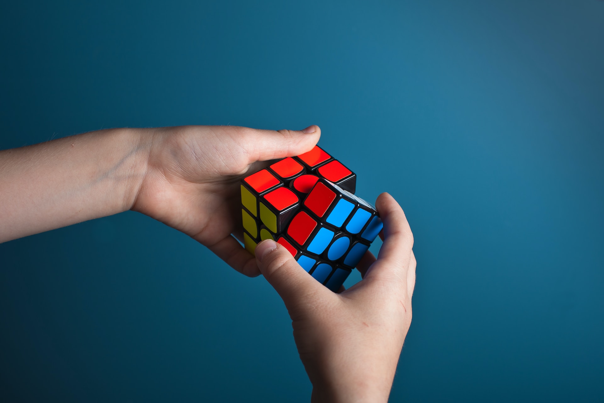 Person solving Rubik's Cube